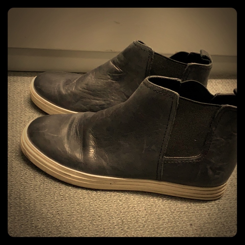 High top black slip on sneakers